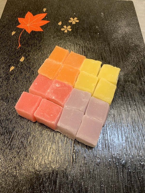 Fruit dango mochi squares: orange, grape, strawberry and lemon flavors.